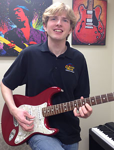 One of our teachers, Ben Wozniak, jams with his electric guitar.